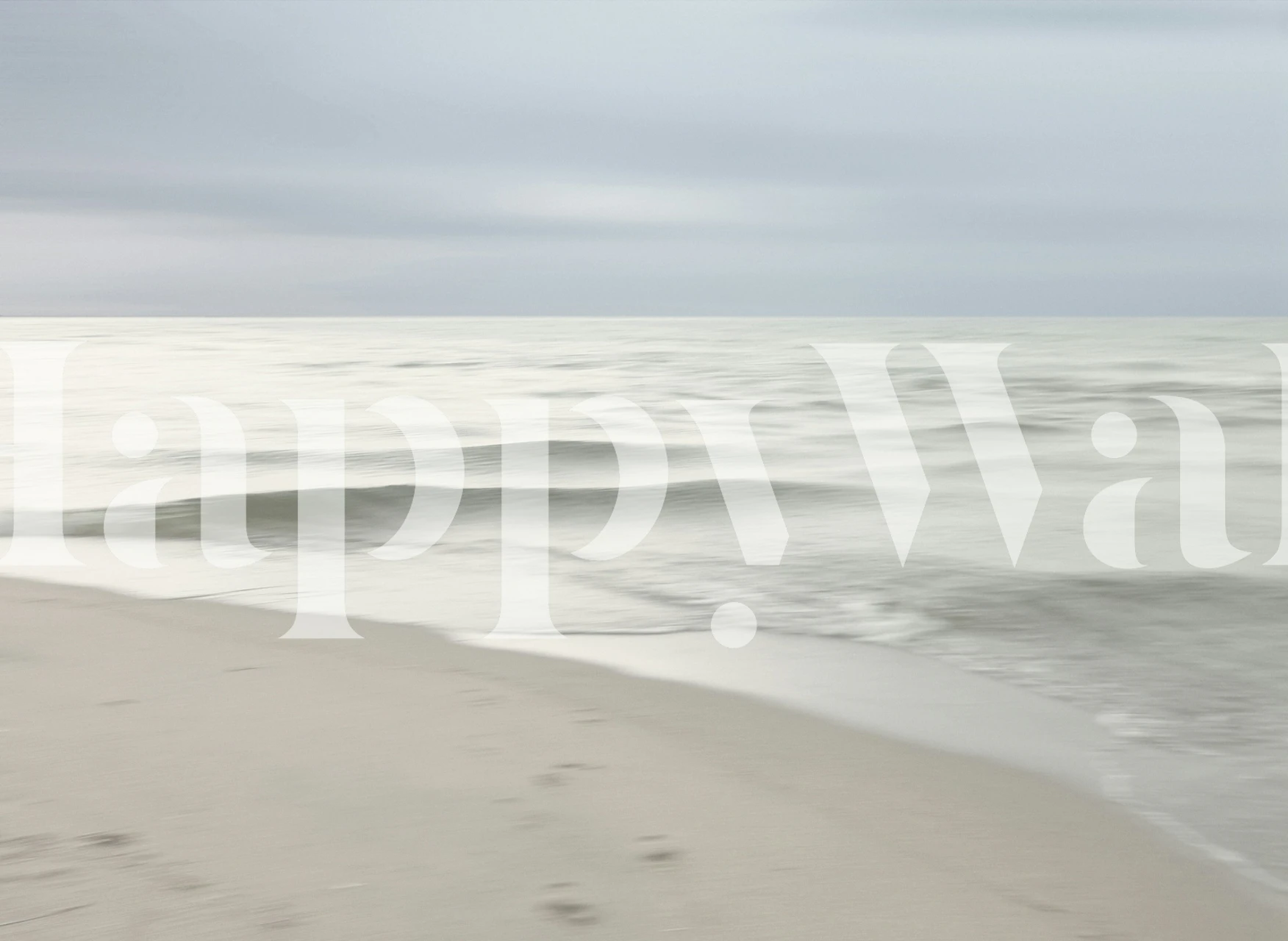 Soft ocean waves and clouds in a serene beach scene wallpaper