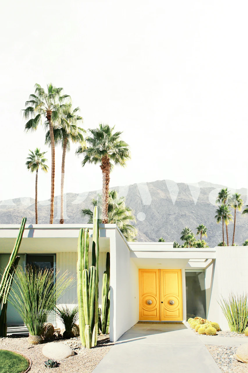 Tropical palm trees and yellow door against mountains wallpaper
