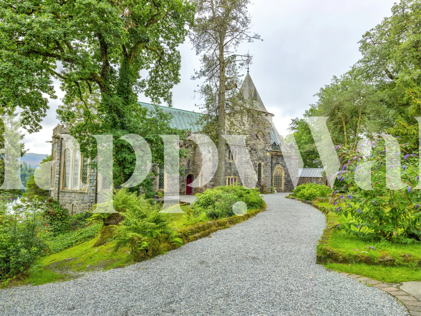 Scottish church surrounded by greenery wallpaper