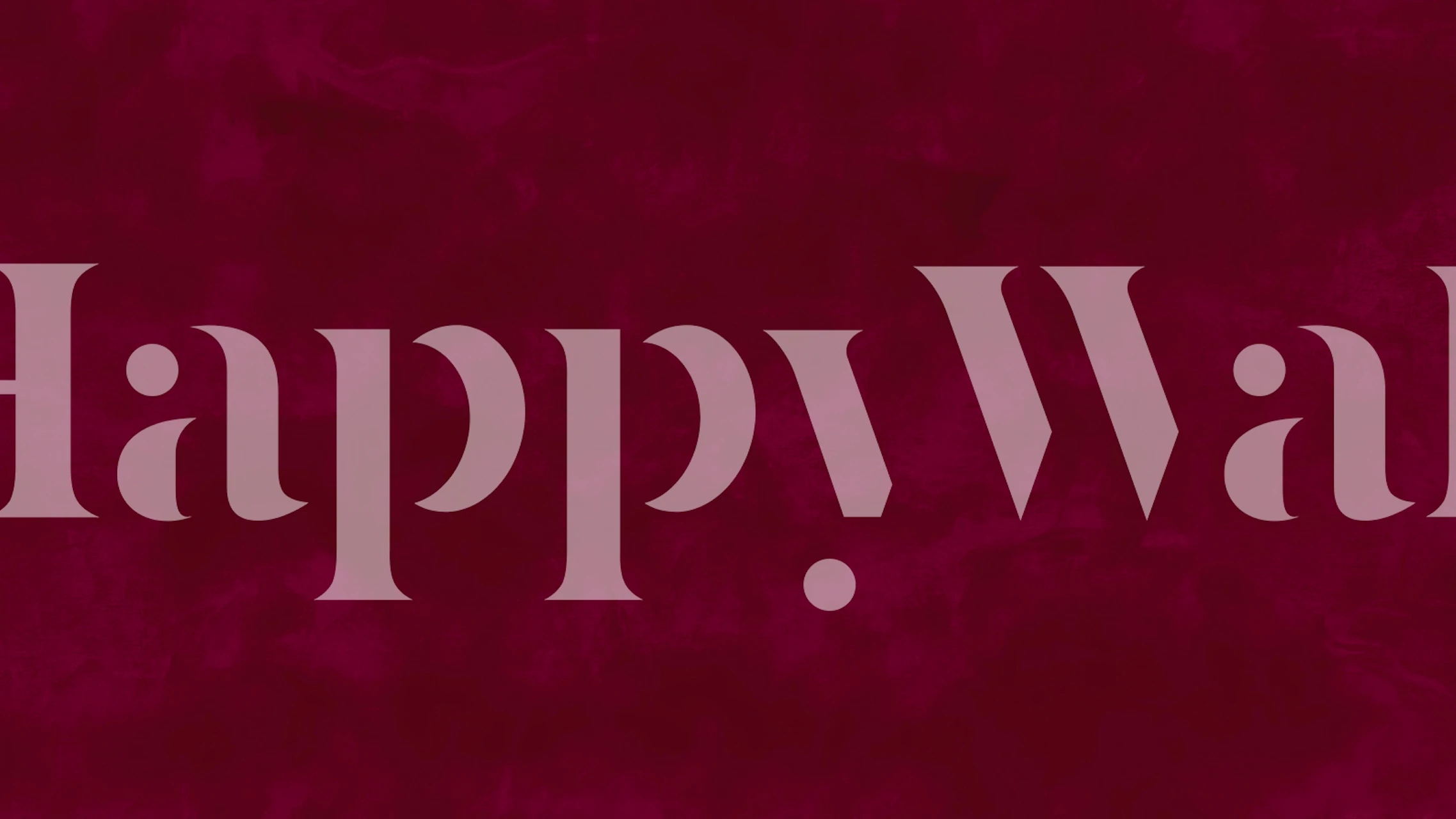 Dark cherry suede texture wallpaper in deep red tones.