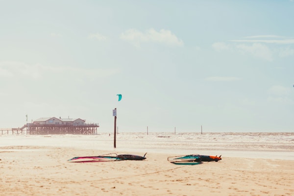 Beach with surfer in front
