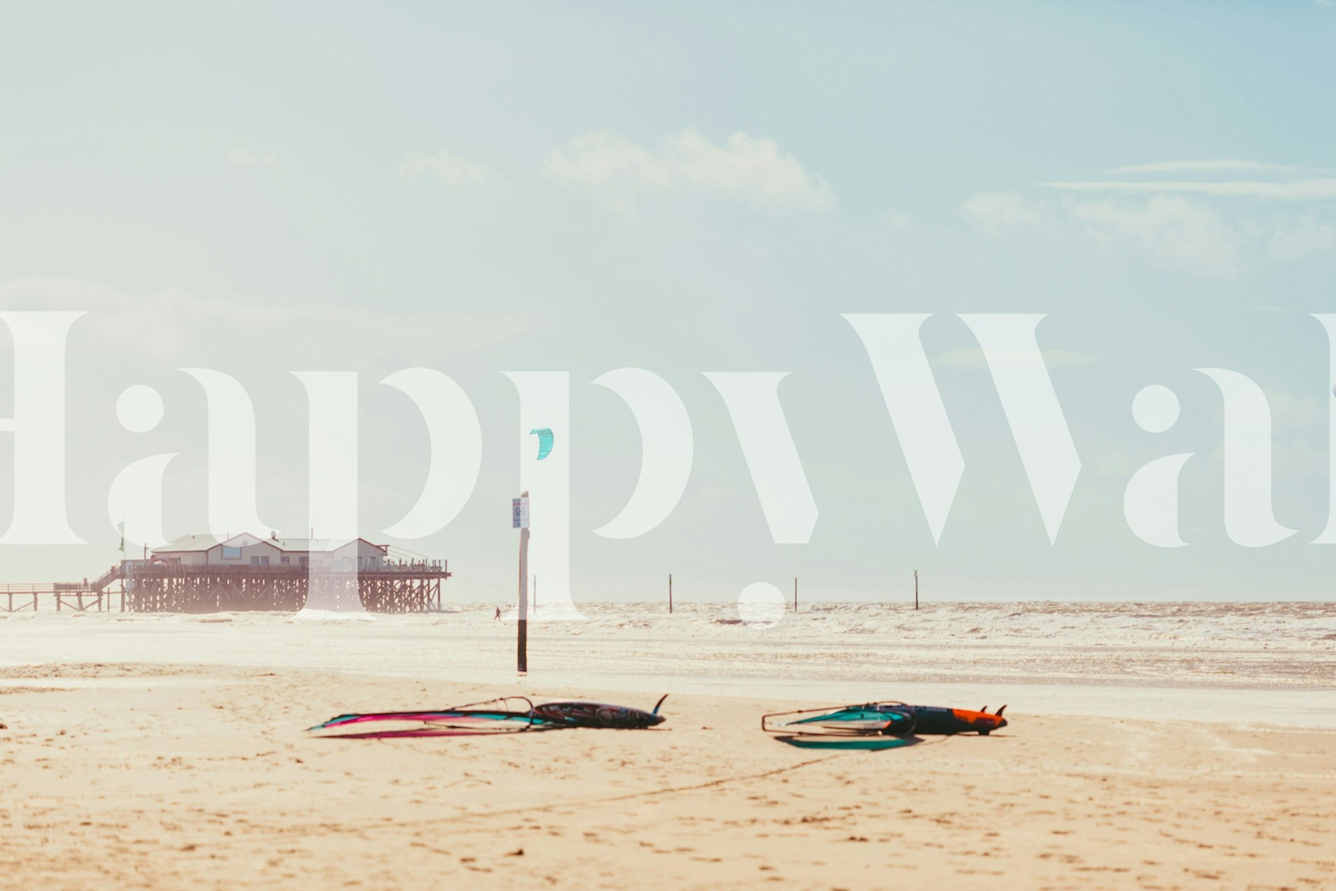 Beach scene with surfers and colorful surfboards wallpaper