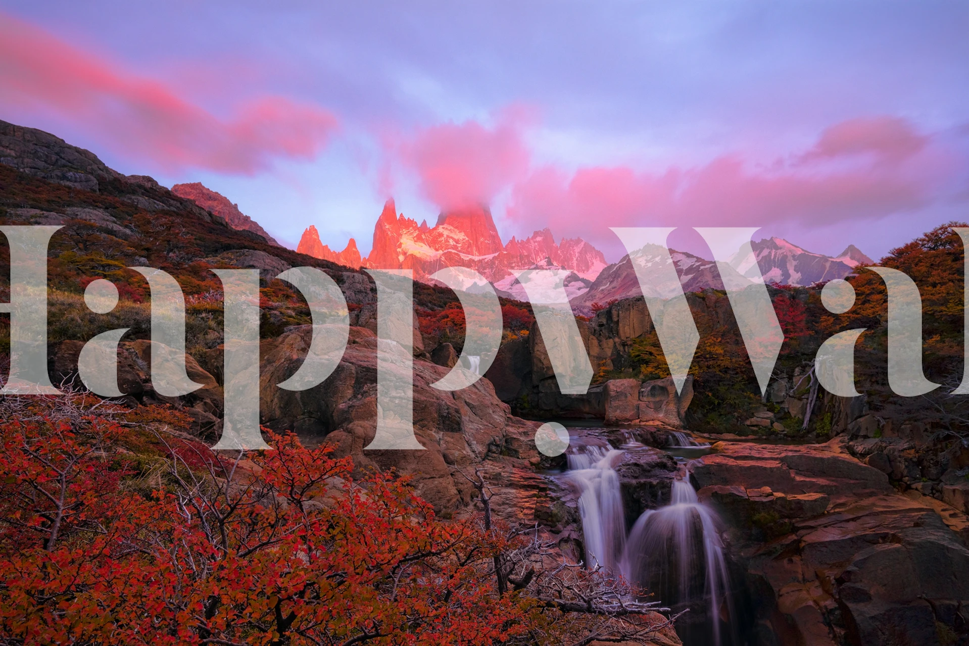 Mountainous landscape with sunrise, waterfall, and autumn foliage wall mural