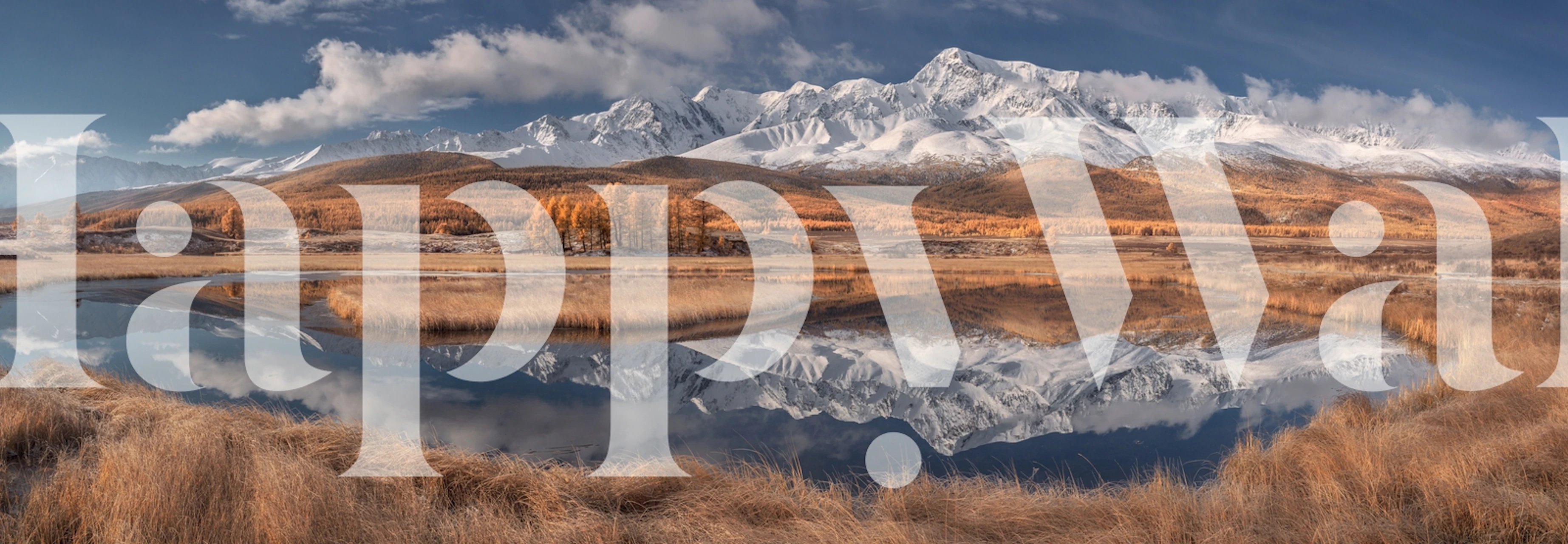 Landscape of mountains and reflection in water with blue skies and golden grasses wallpaper