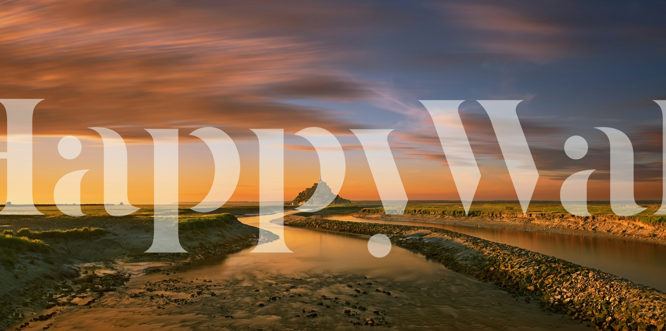 Mont Saint Michel at sunset with river and sand