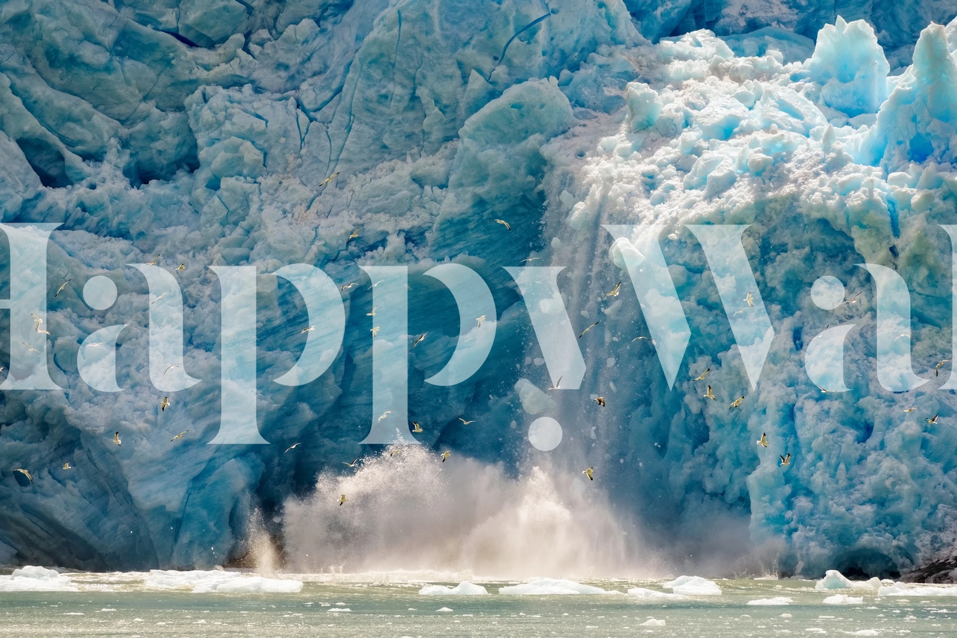 Glacier calving wall mural with intense blue ice and dynamic splash