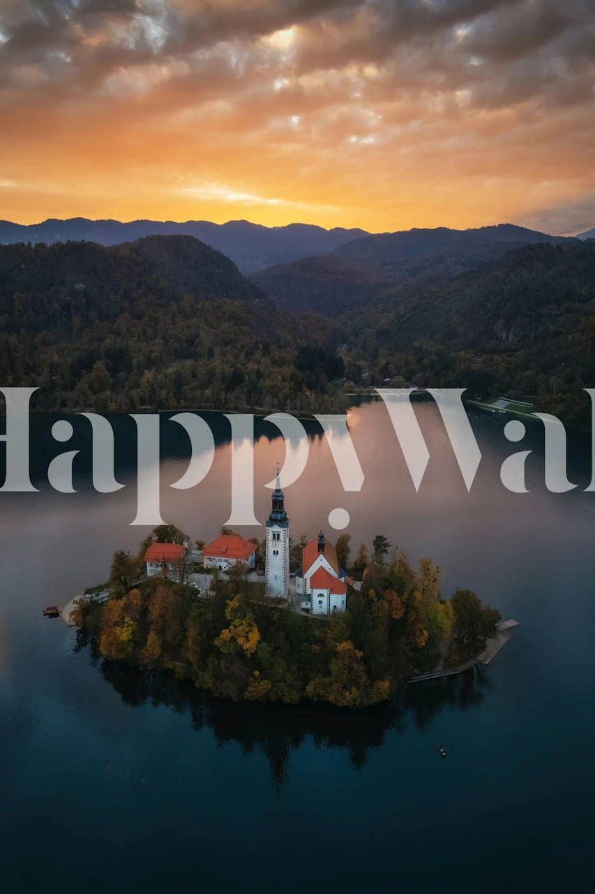 Aerial view of Lake Bled at sunset with reflections on water, vibrant sky colors wallpaper