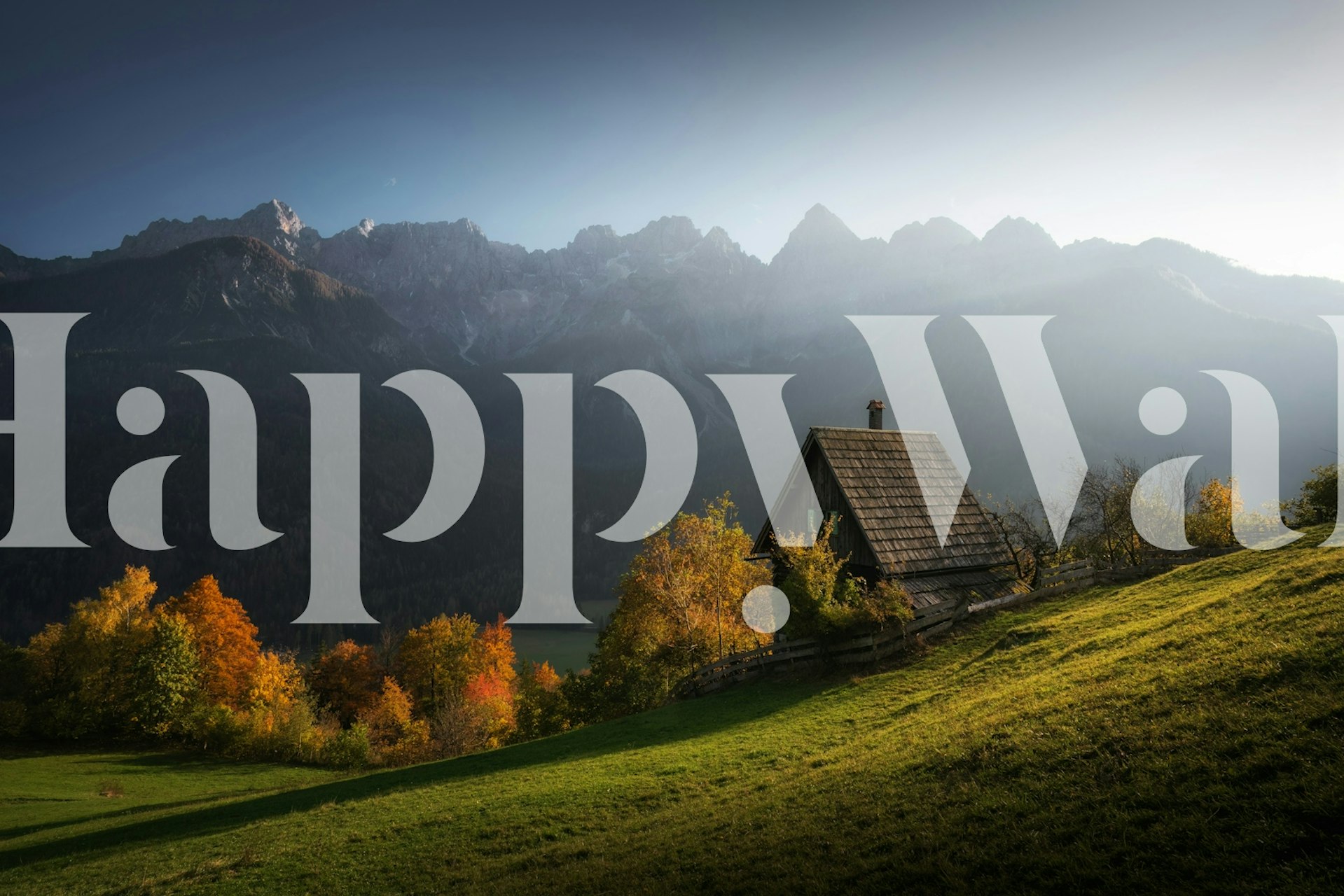 Rustic cabin in Slovenia with mountains and autumn foliage