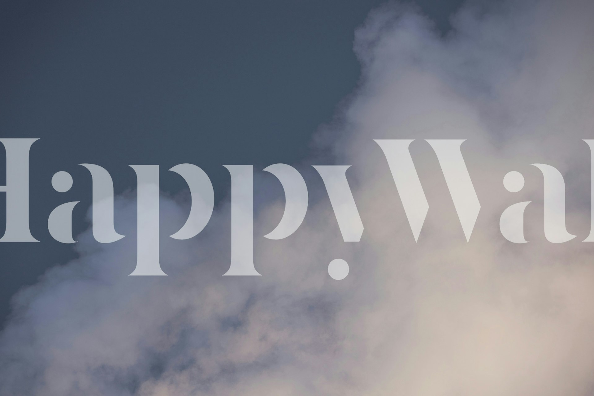 Fluffy white clouds on a blue background wallpaper