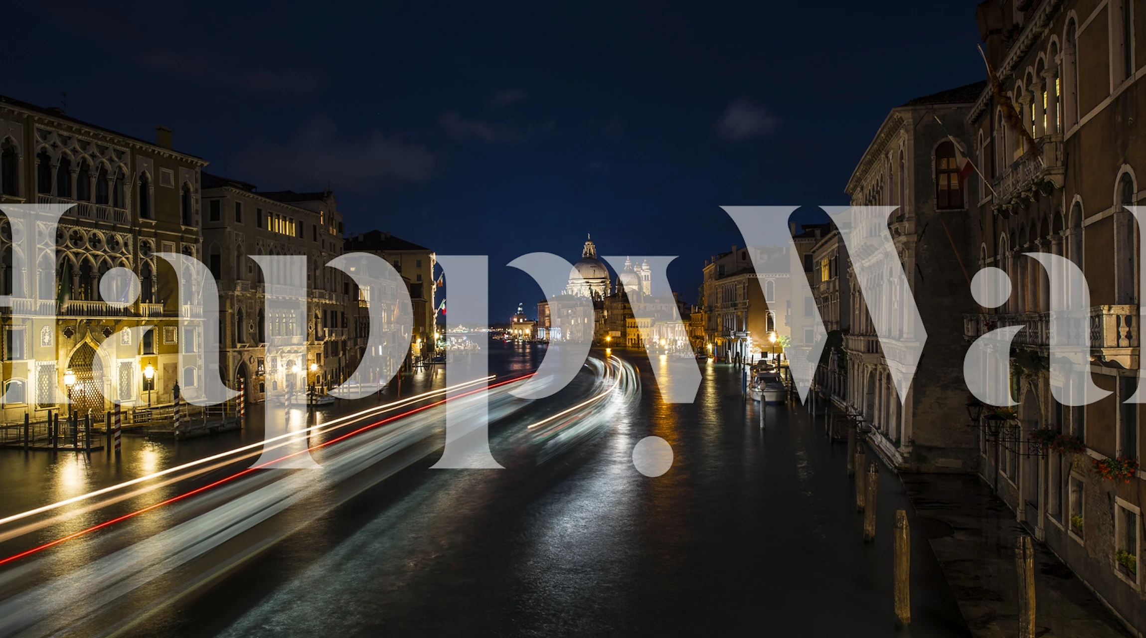 Venice canal at night with illuminated buildings and reflections wallpaper