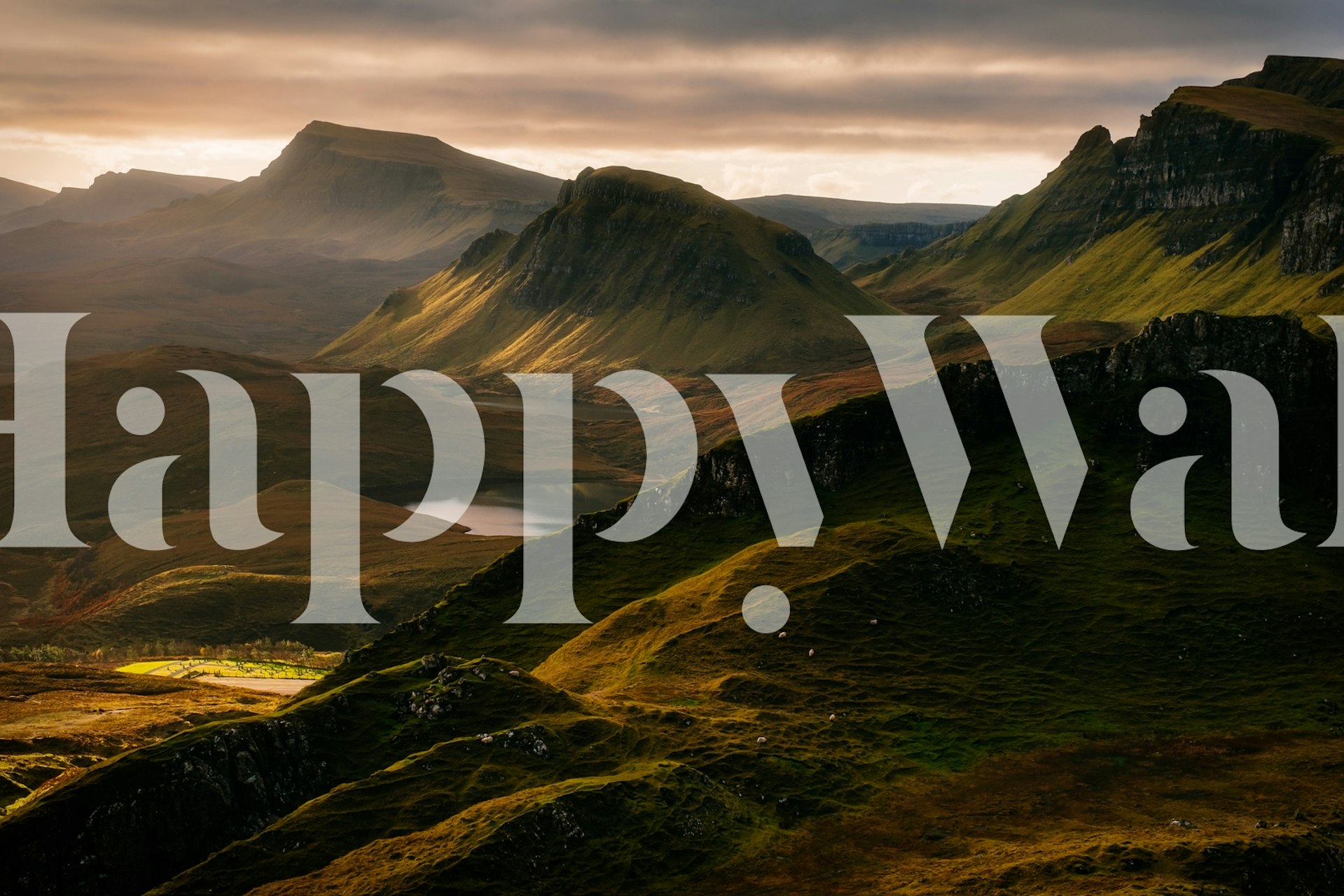 Mountains and hills in varying shades of green and brown wallpaper