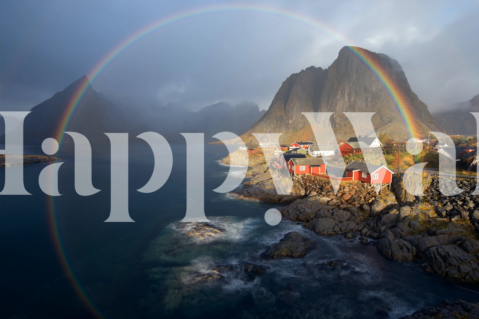 Rainbow arc over coastal village with red houses wallpaper