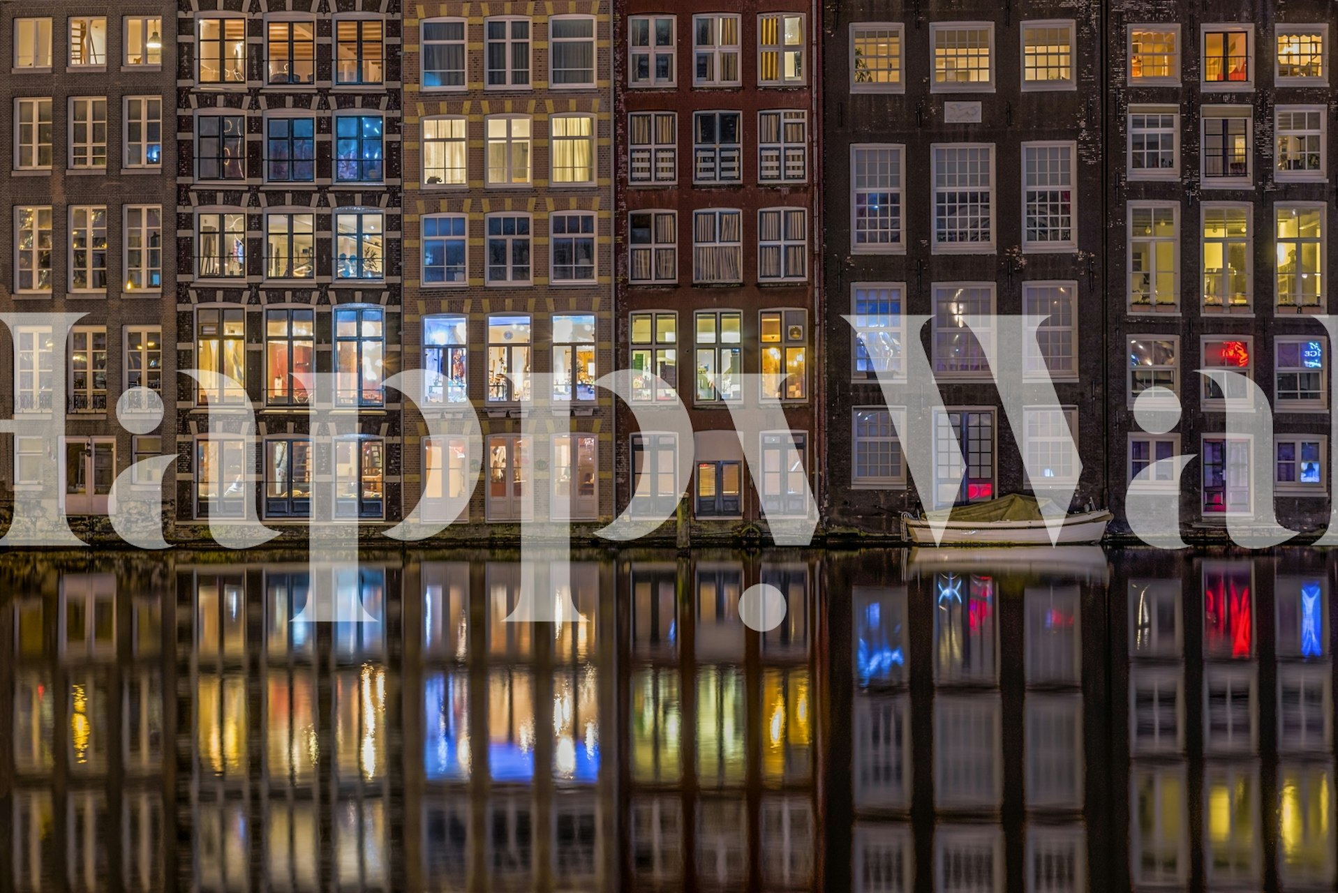 Urban night windows wall mural with reflection on water, capturing the vibrant life and colors of city dwellings.