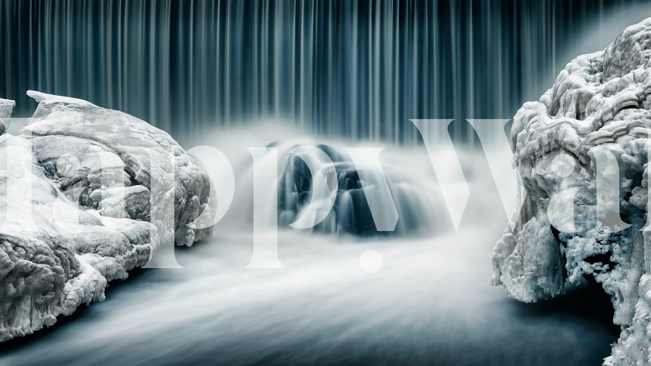 Icy blue waterfall with white rocks and smooth water wallpaper