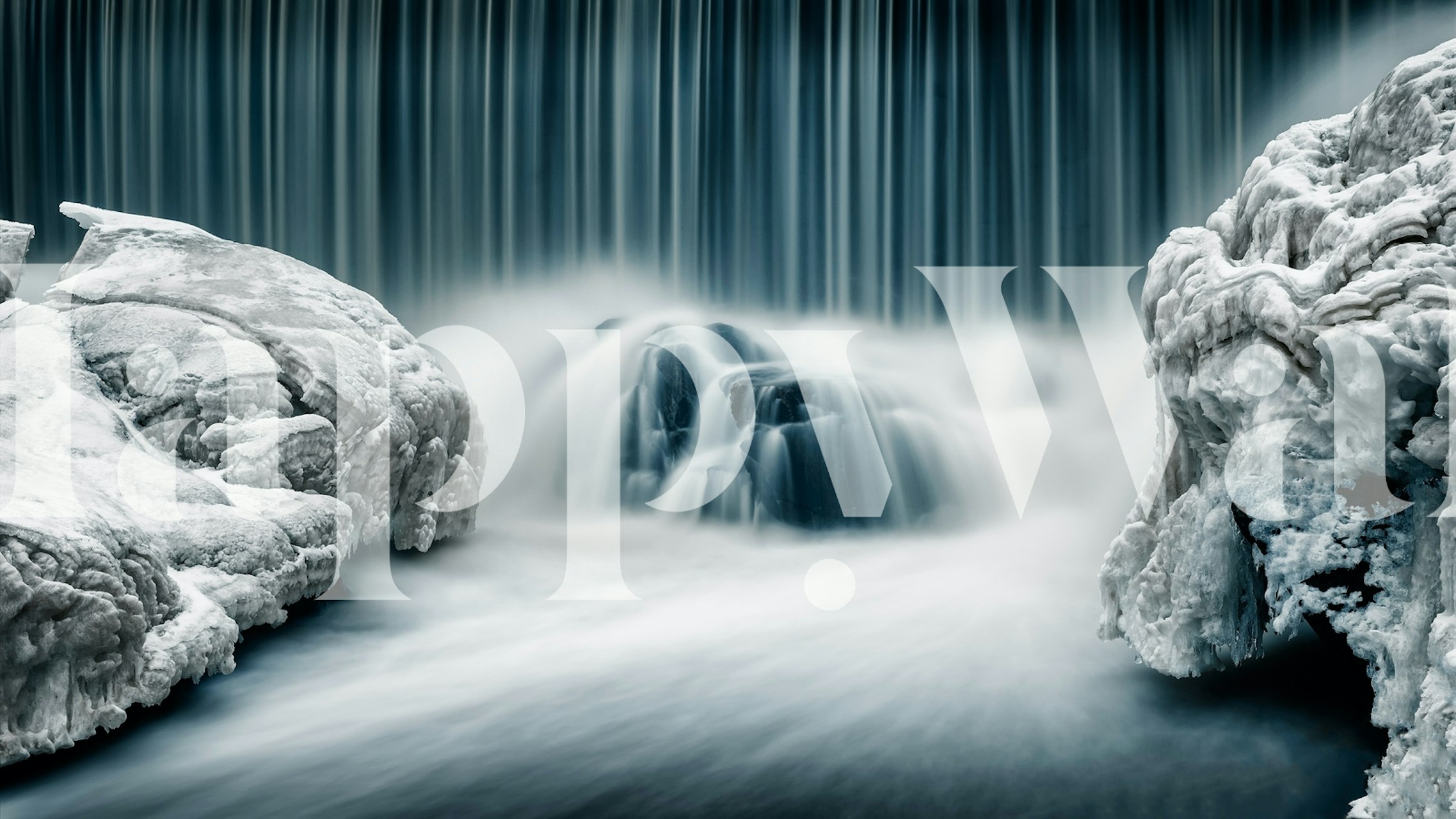 Icy blue waterfall with white rocks and smooth water wallpaper