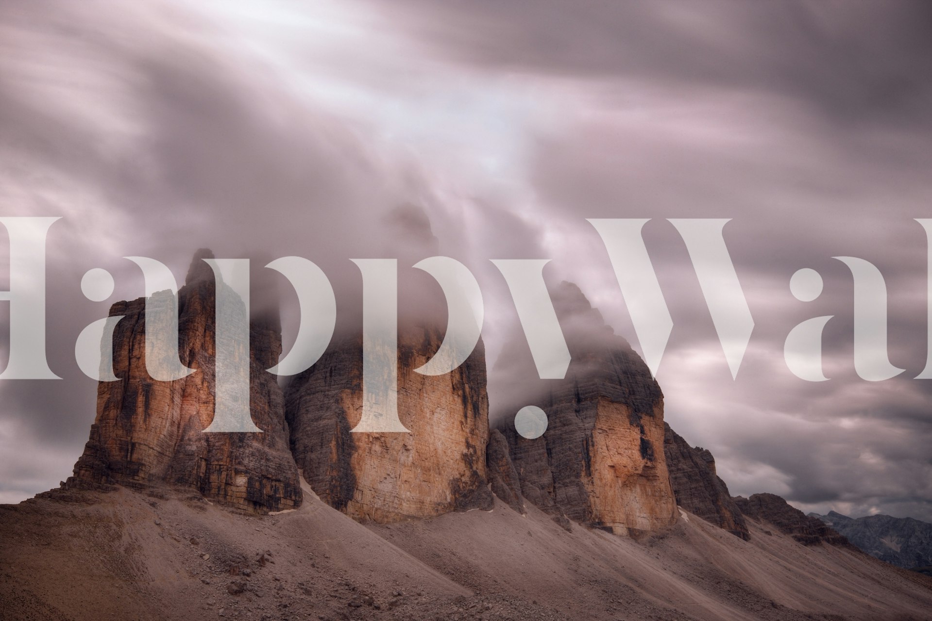 Foggy mountain peaks wall mural with misty clouds