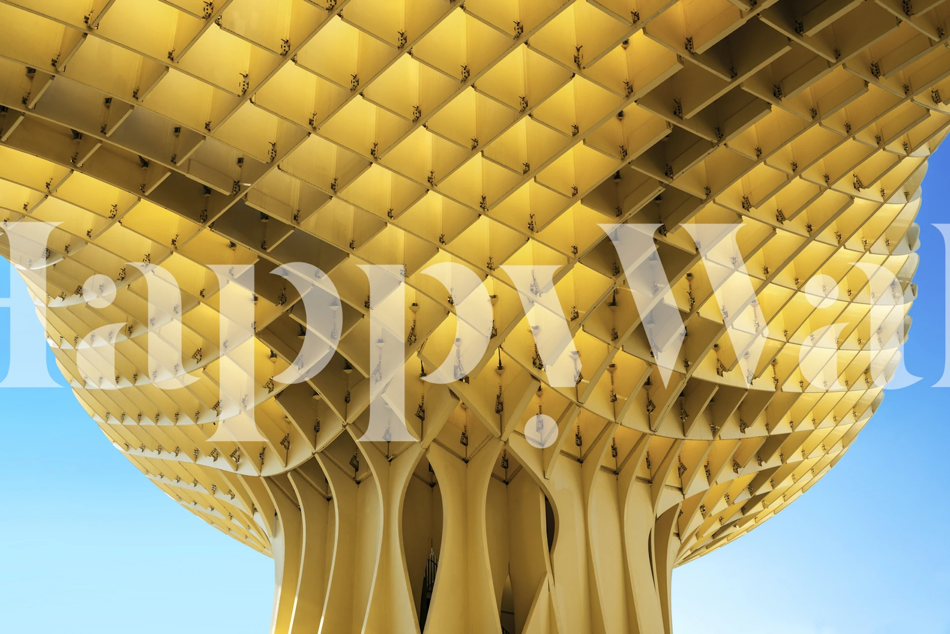 Geometric gold parasol over city-inspired wall mural