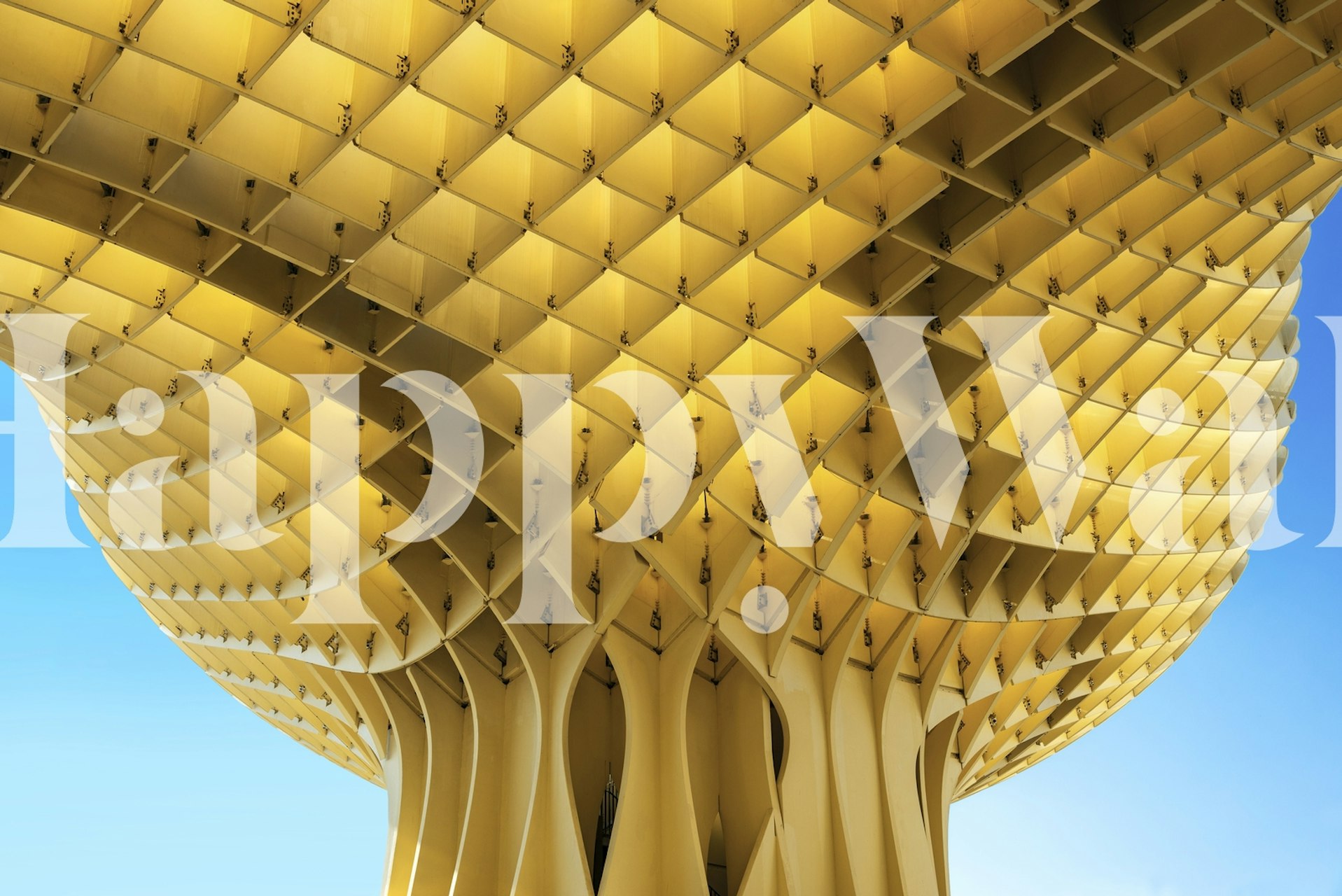 Geometric gold parasol over city-inspired wall mural