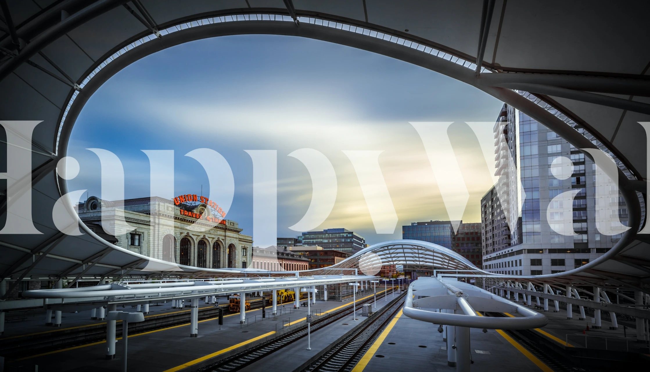 Sunset over Denver Union Station with urban architecture and soft colors wallpaper