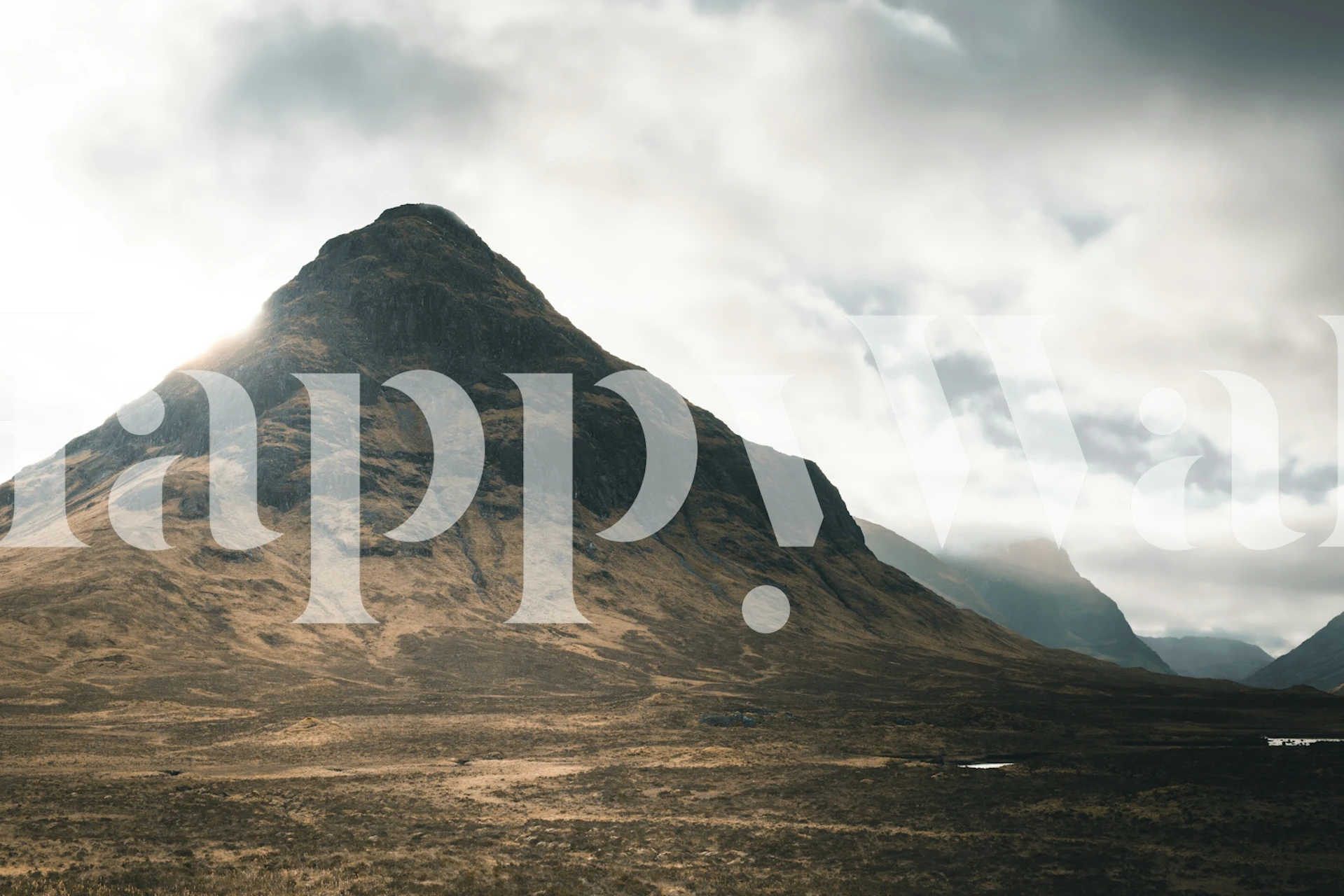 Mountainous landscape with soft clouds, earthy tones wallpaper