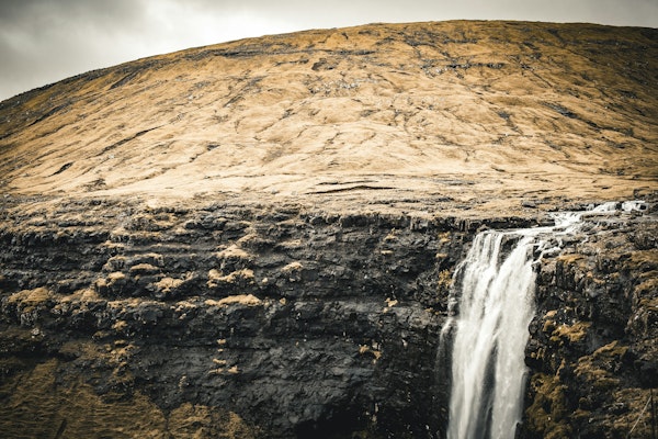 Golden Cliff Waterfall View