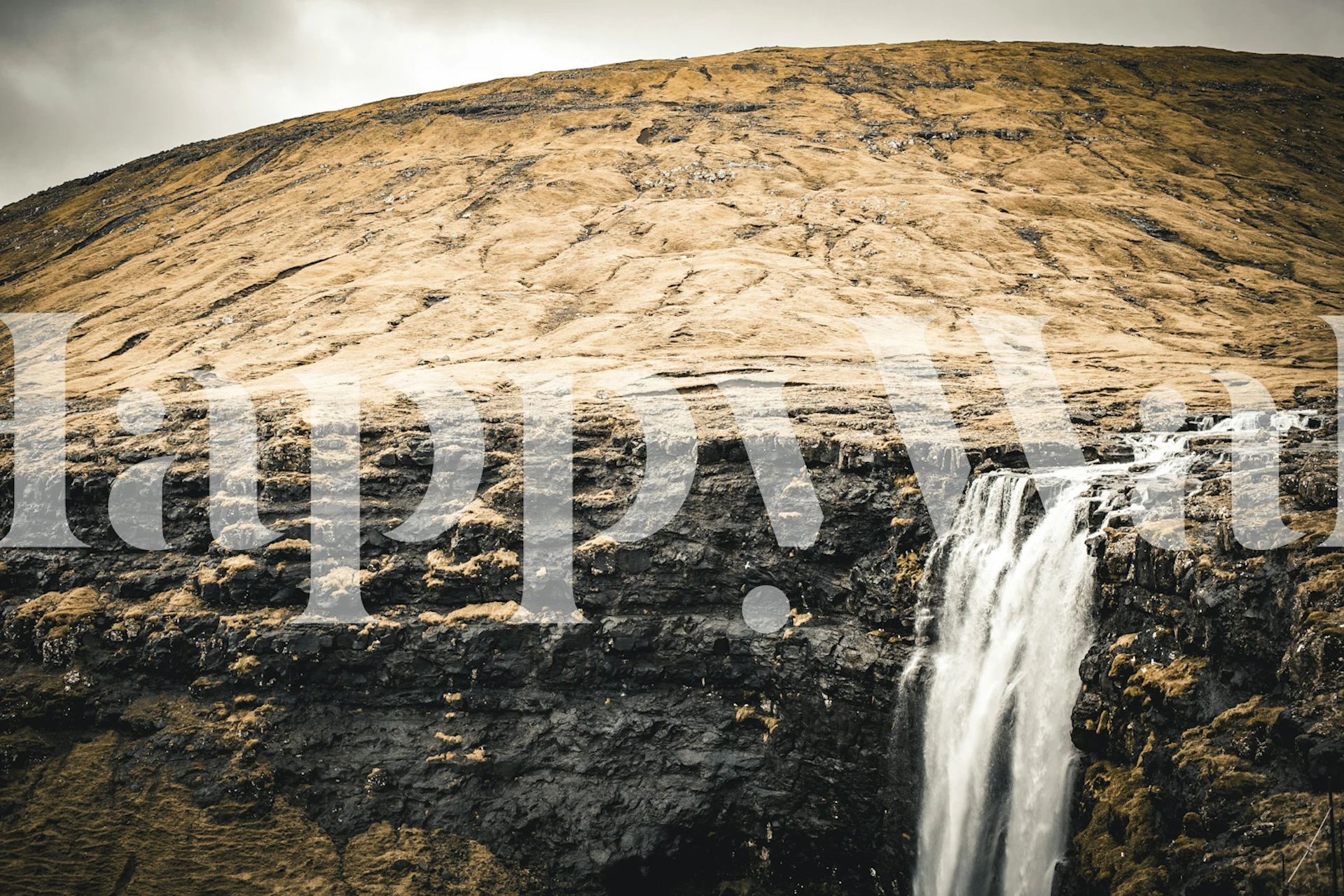 Golden Cliff Waterfall View wallpaper in a room