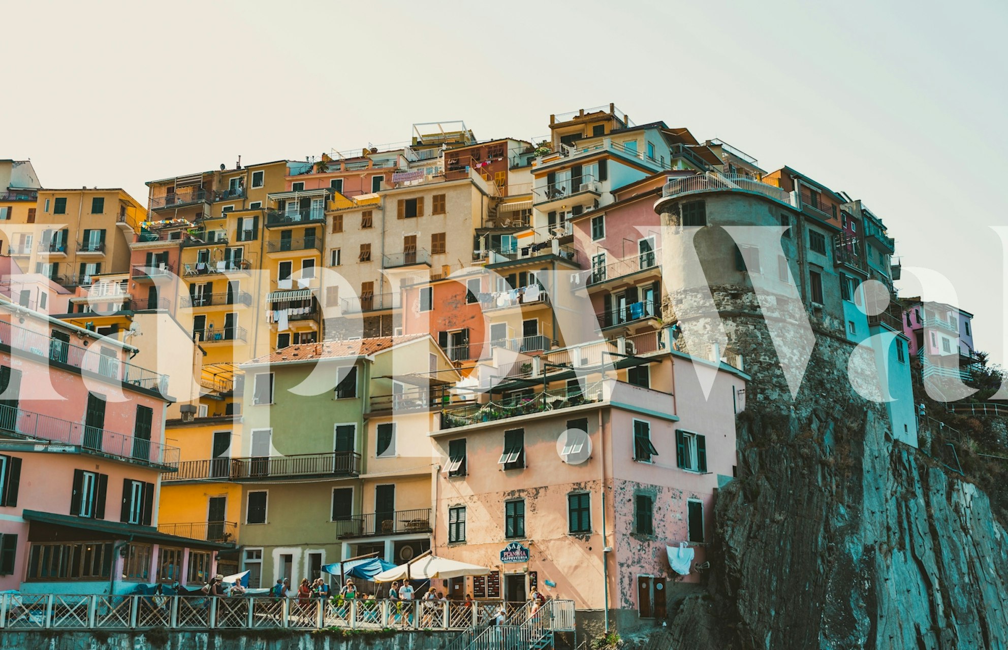 Vibrant townscape wallpaper featuring colorful buildings and rocky terrain