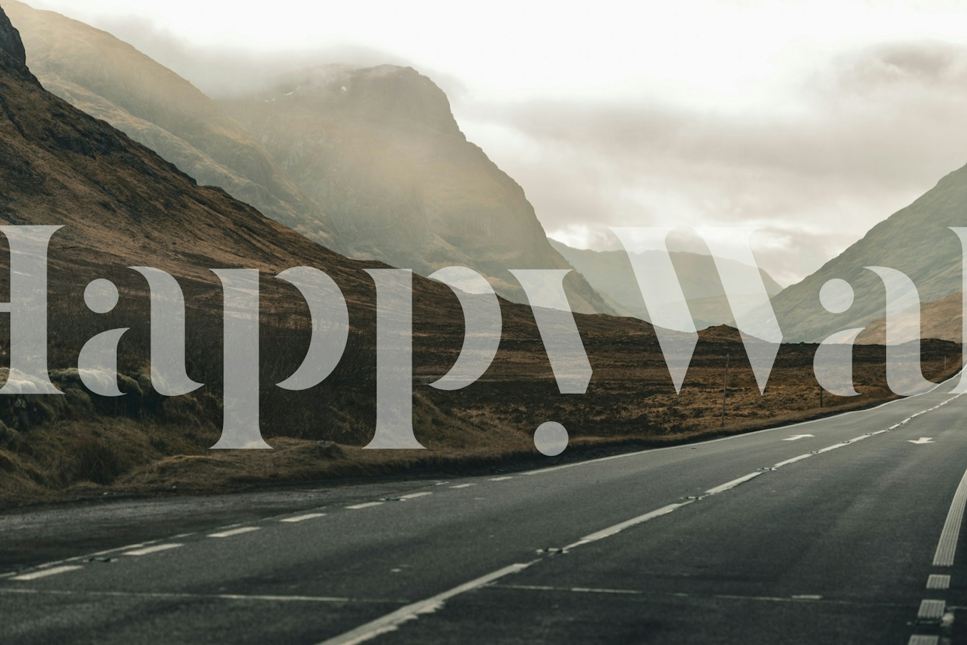 Serene Scottish valley landscape with mountains and road wallpaper