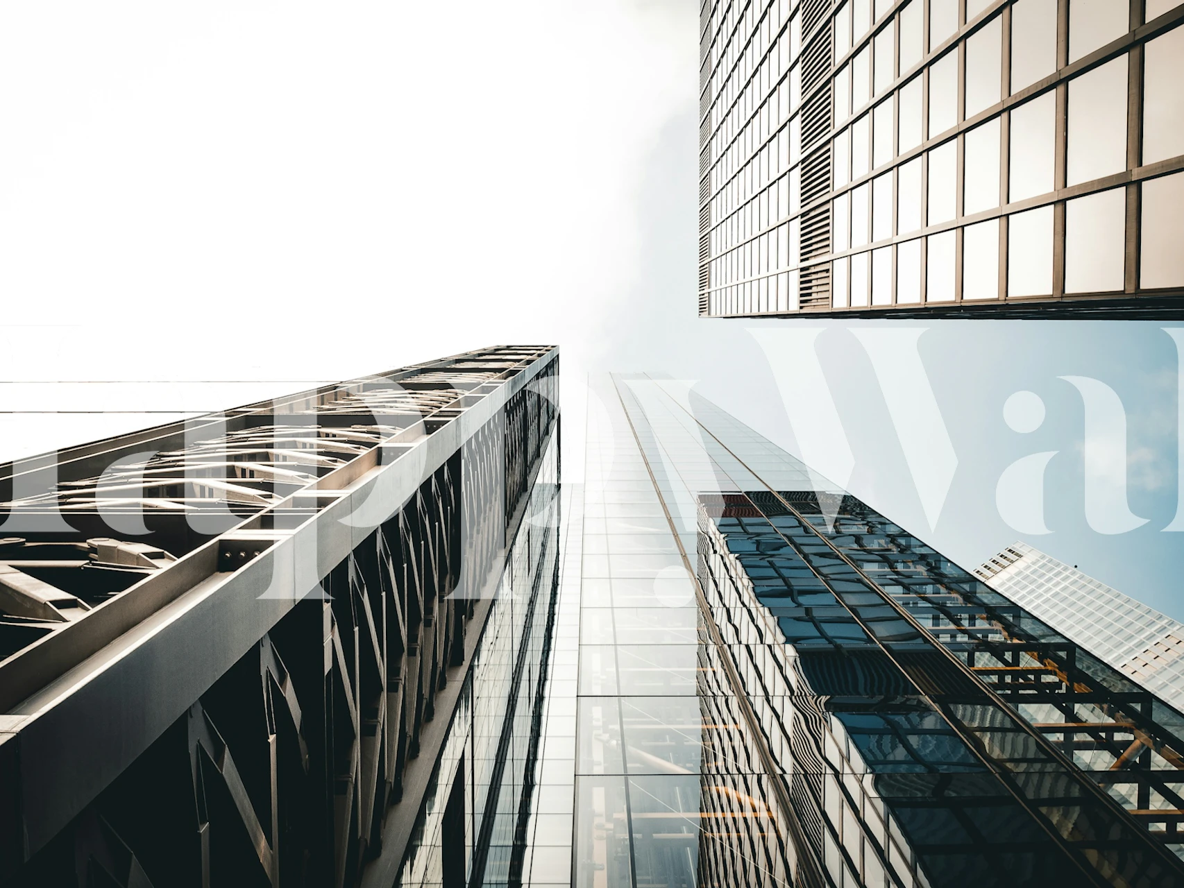 City skyline with reflective glass buildings and blue sky wallpaper