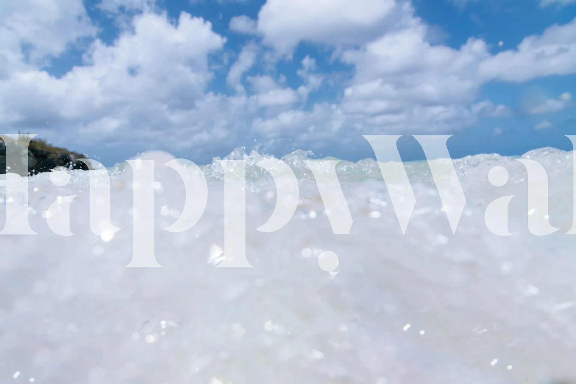 Caribbean sea waves with white foam and blue sky wallpaper