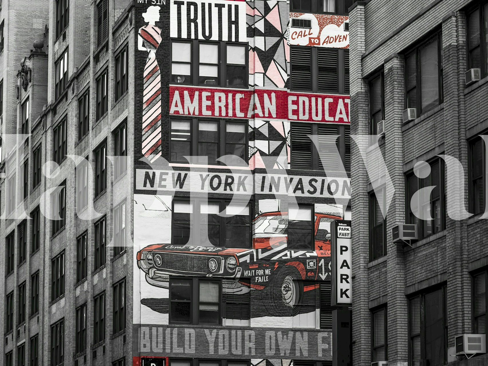 Black and white graphic wallpaper depicting urban mural with text and car designs.