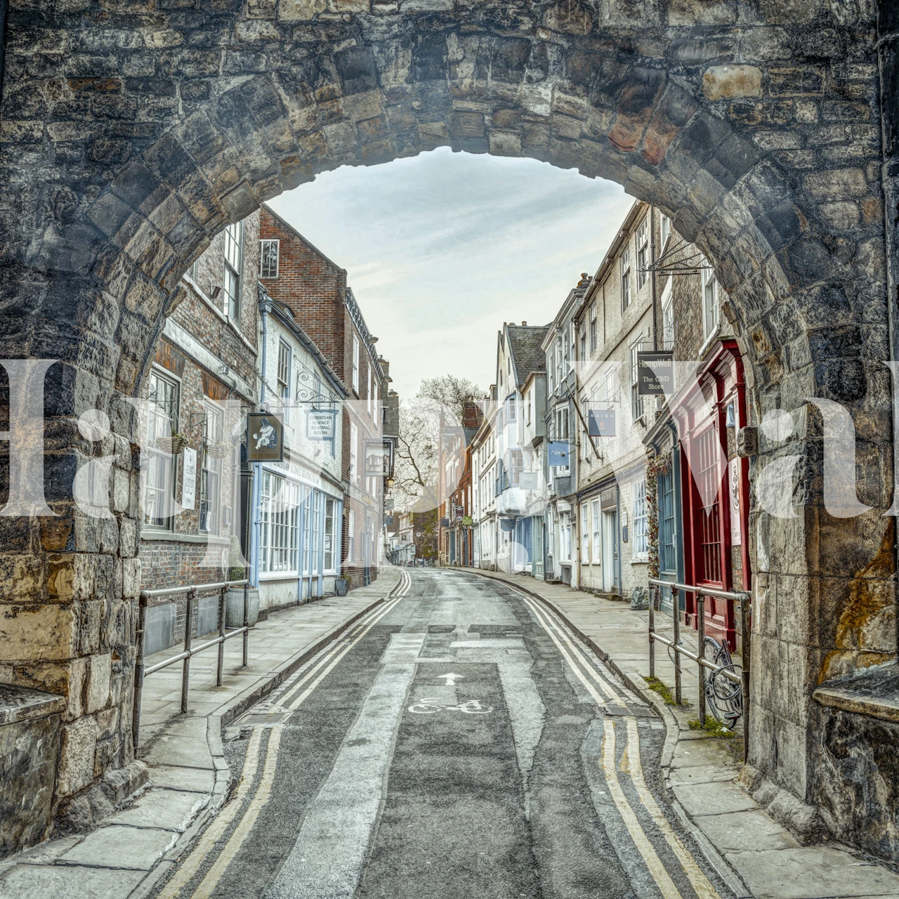 Historic stone archway street view wallpaper