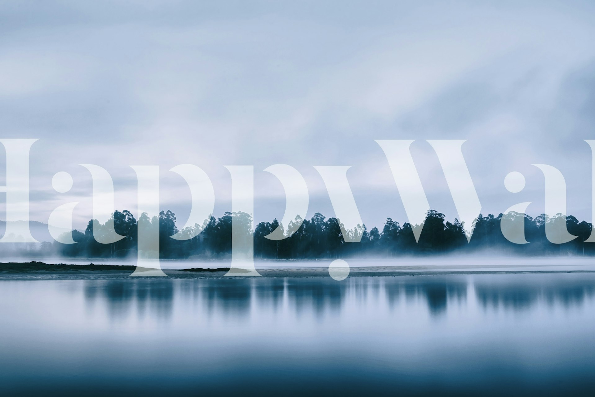 Calm lake reflection with blue tones and misty scenery wallpaper
