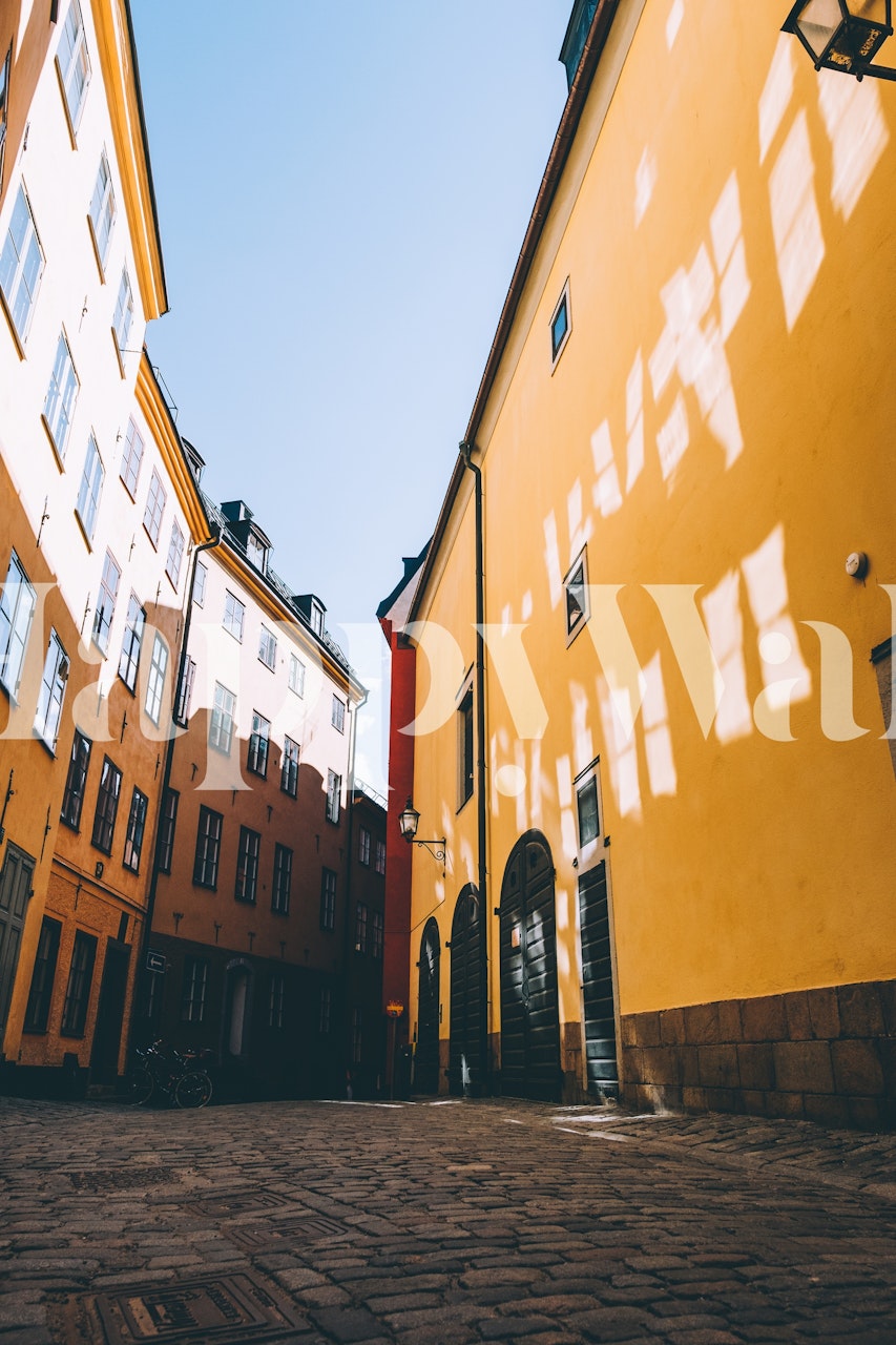 Vibrant yellow urban street with reflected light wallpaper