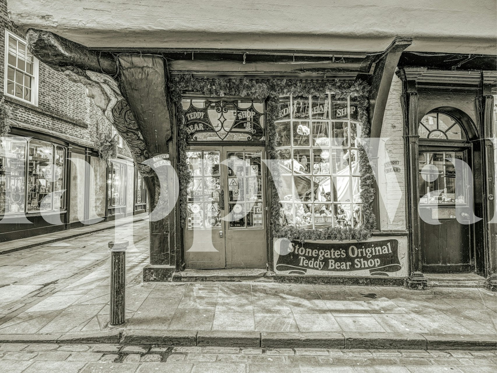 Vintage teddy bear shop exterior in black and white wallpaper