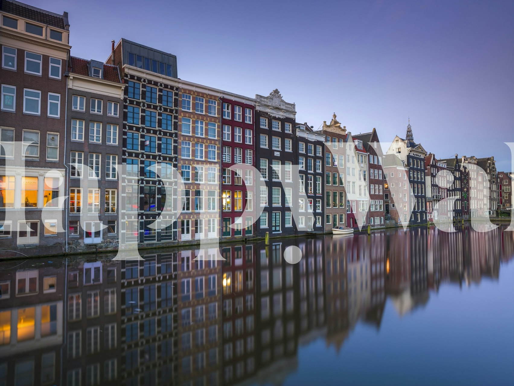 Amsterdam canal houses reflected on water at sunset wallpaper