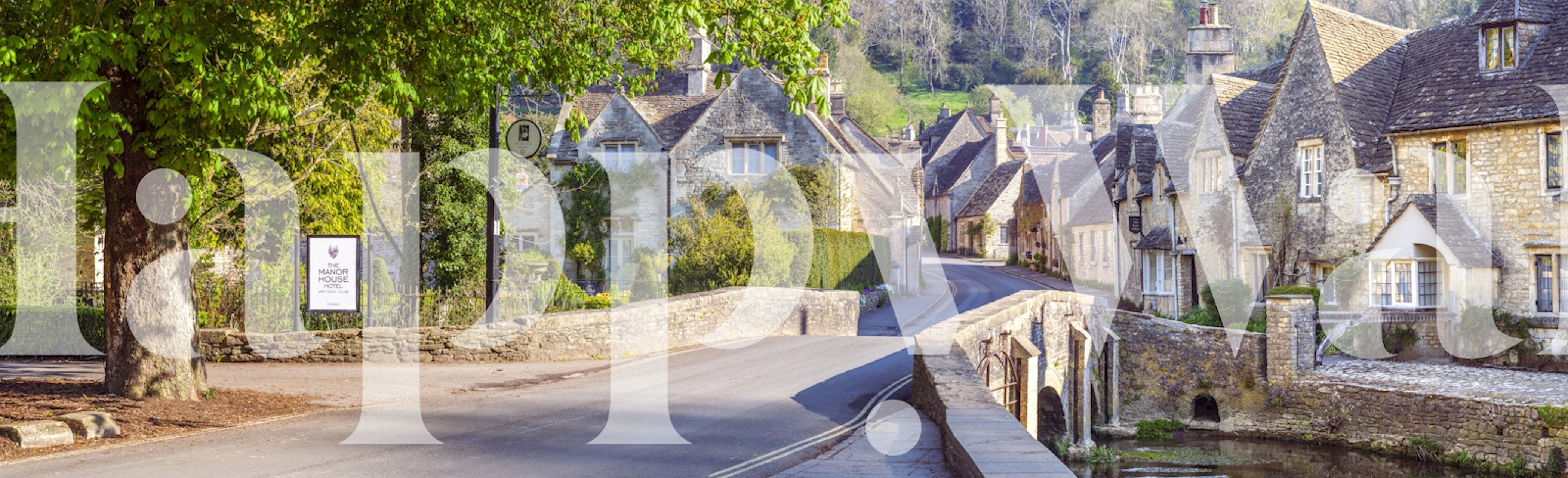 Charming stone cottages with greenery in Castle Combe wallpaper