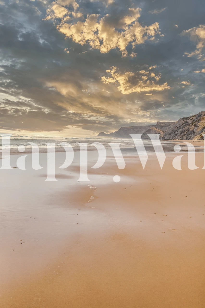 Beach sunset view with sandy shore and cloudy sky wallpaper