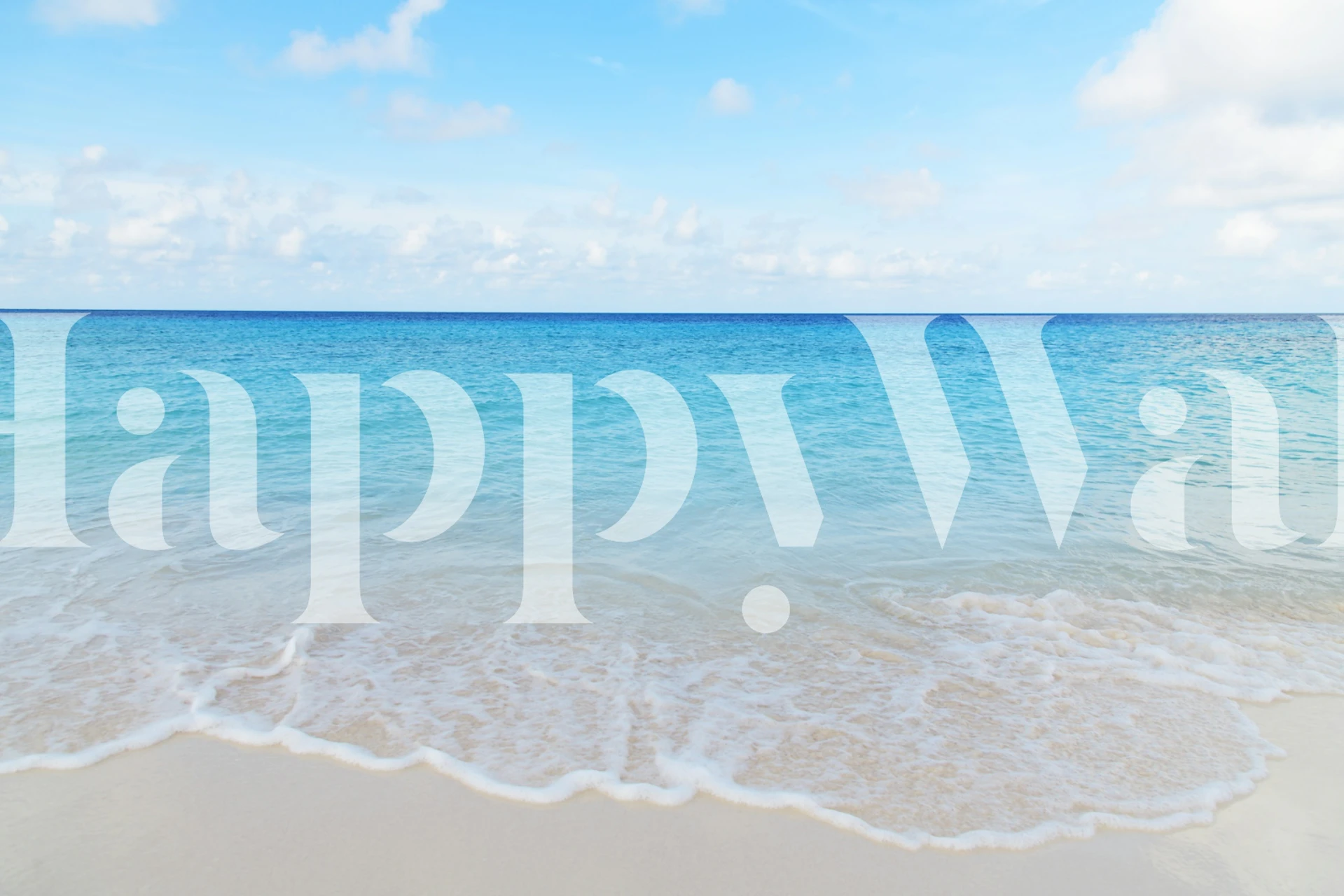Ocean waves lapping on sandy beach with blue sky wallpaper