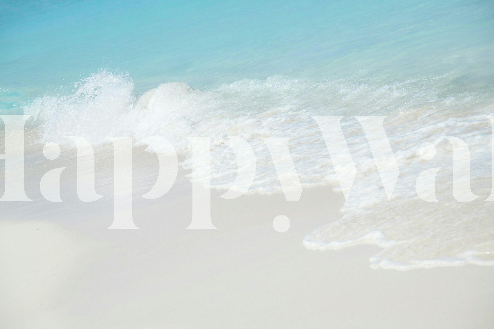 Soft waves crashing on a sandy beach with turquoise water wallpaper