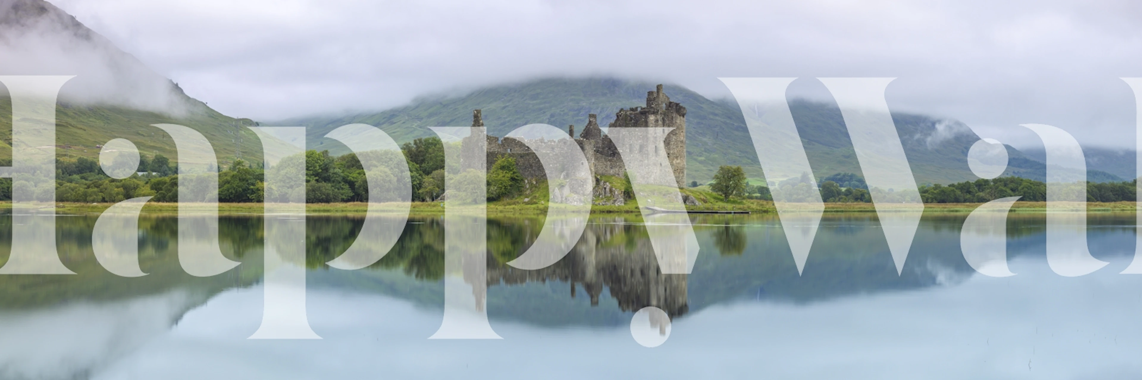 Kilchurn Castle reflecting in tranquil water surrounded by green hills wallpaper