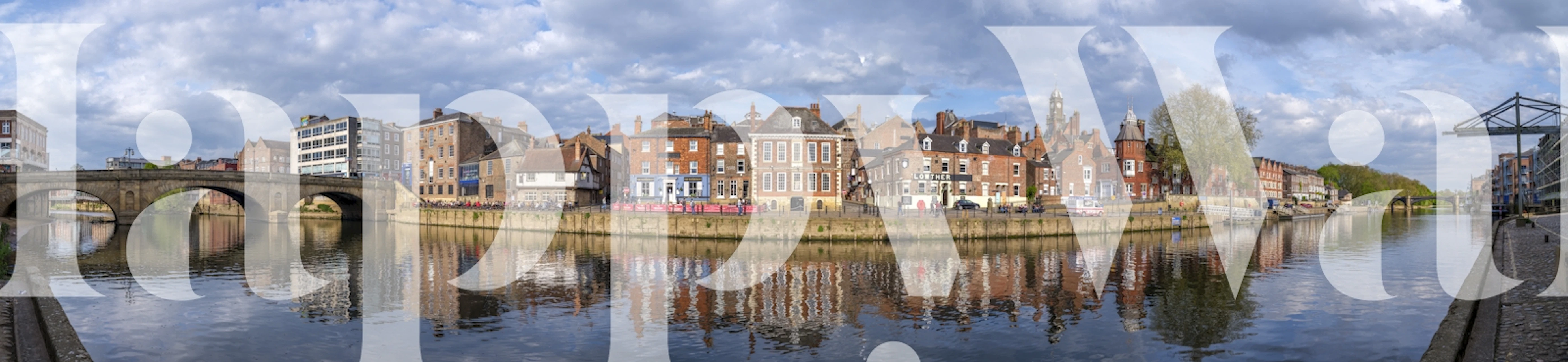 Picturesque riverfront scene with colorful buildings and reflections wallpaper