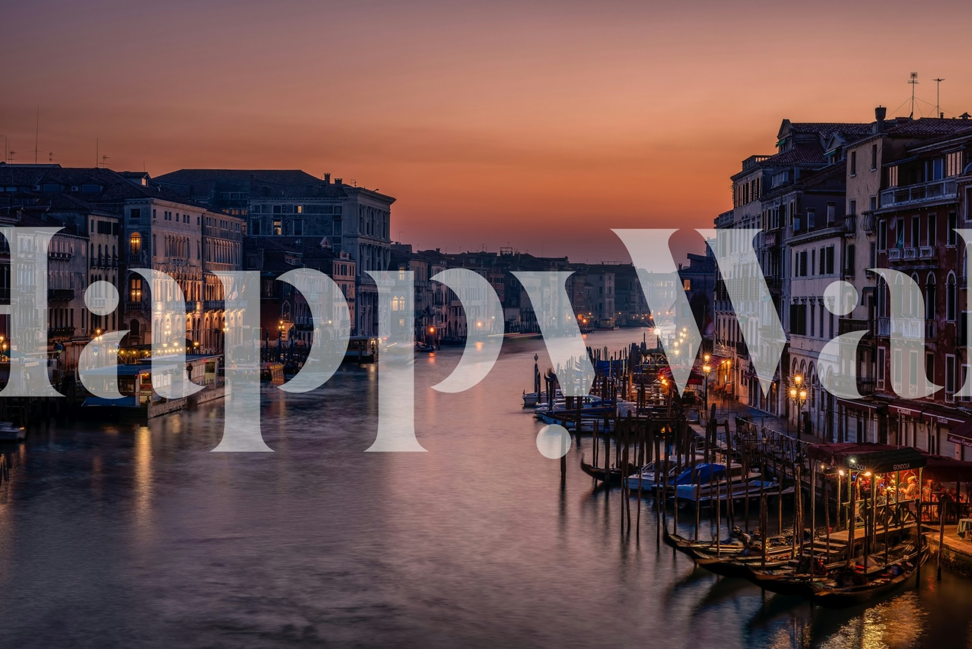 Venice Grand Canal at sunset with orange hues and reflections wallpaper