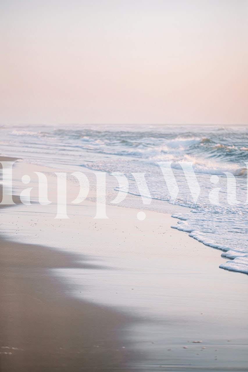 Beach waves on sandy shore in pastel blue and soft pink wallpaper