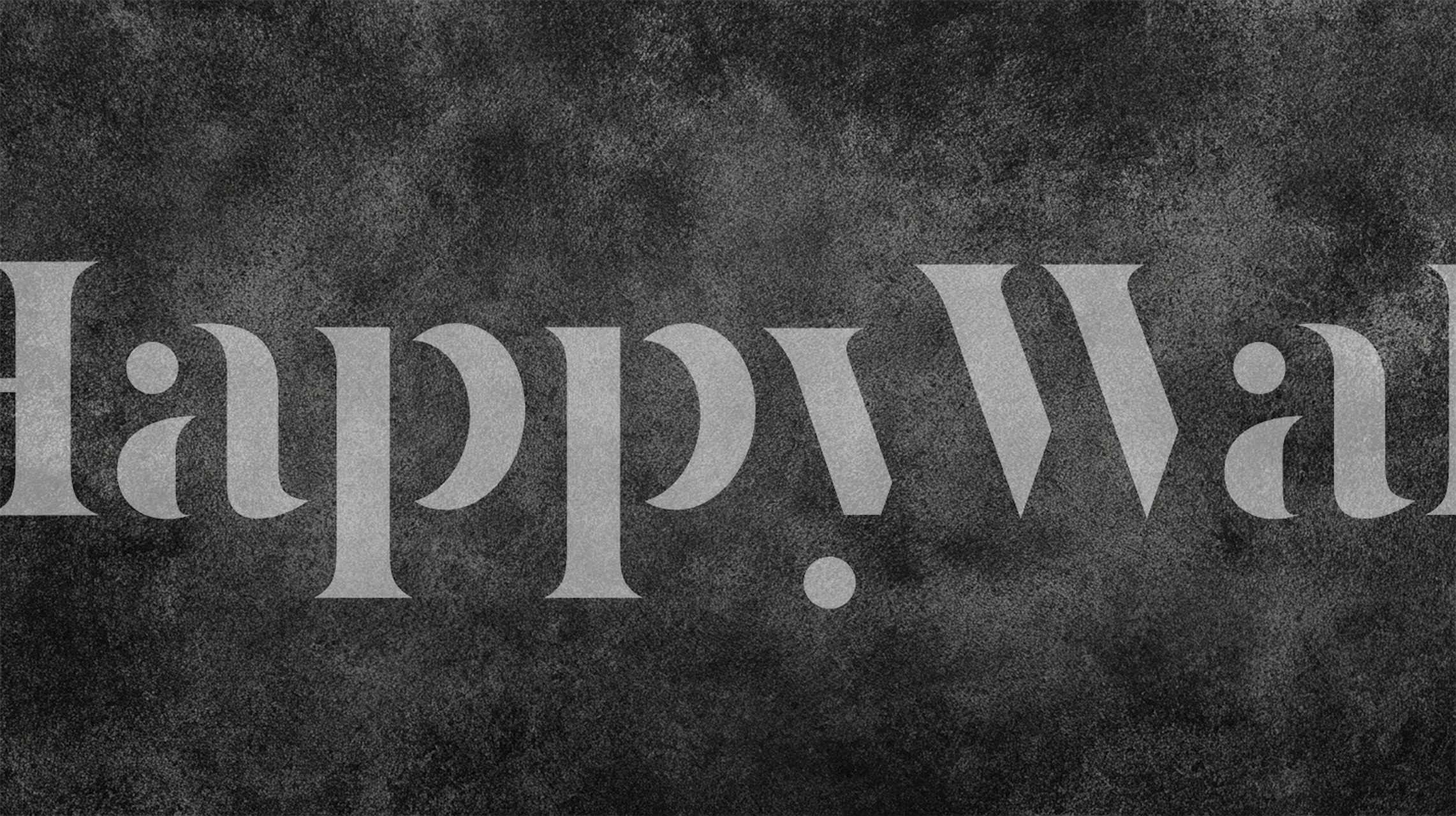 Charcoal black concrete textured wallpaper in room