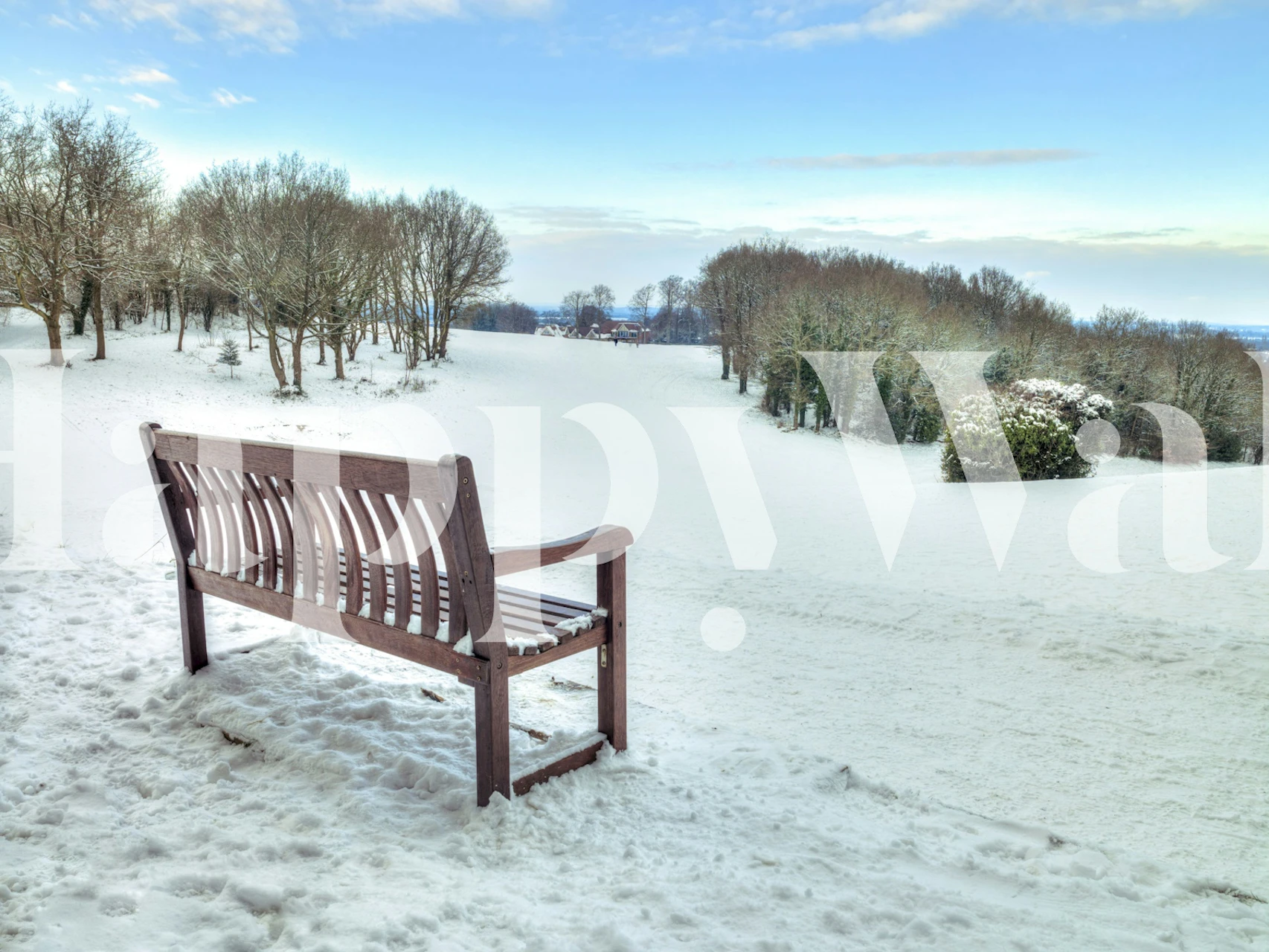 Bench in snowy landscape wallpaper