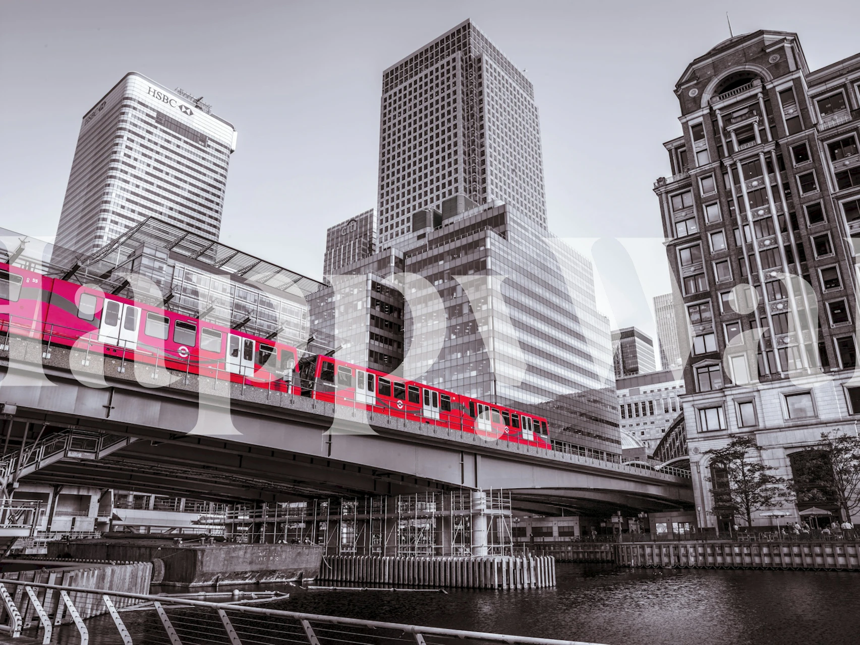 Cityscape with pink train amidst gray buildings wallpaper