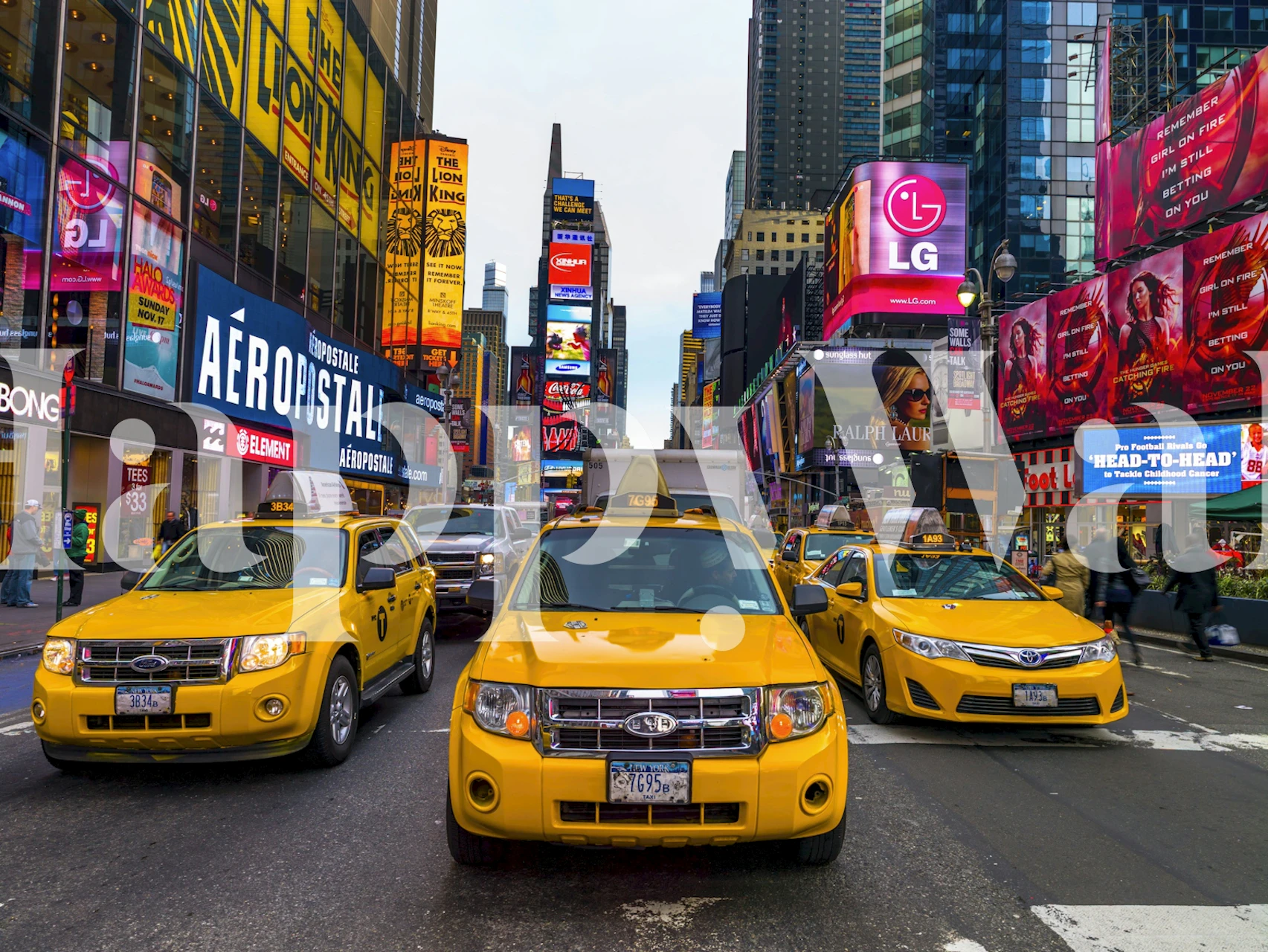 Yellow taxis in a vibrant urban setting