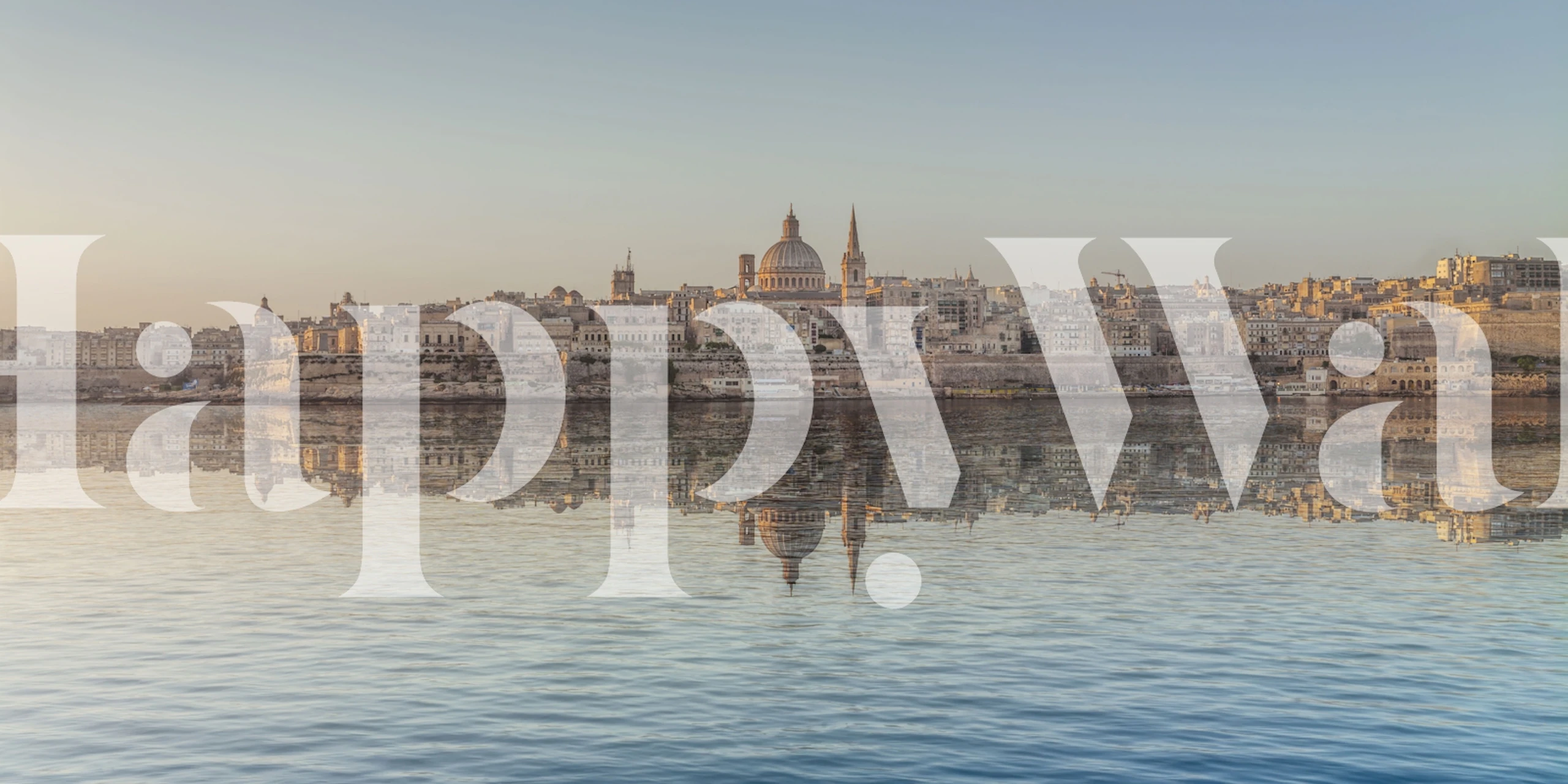 Valletta reflection in warm colors over calm waters wallpaper