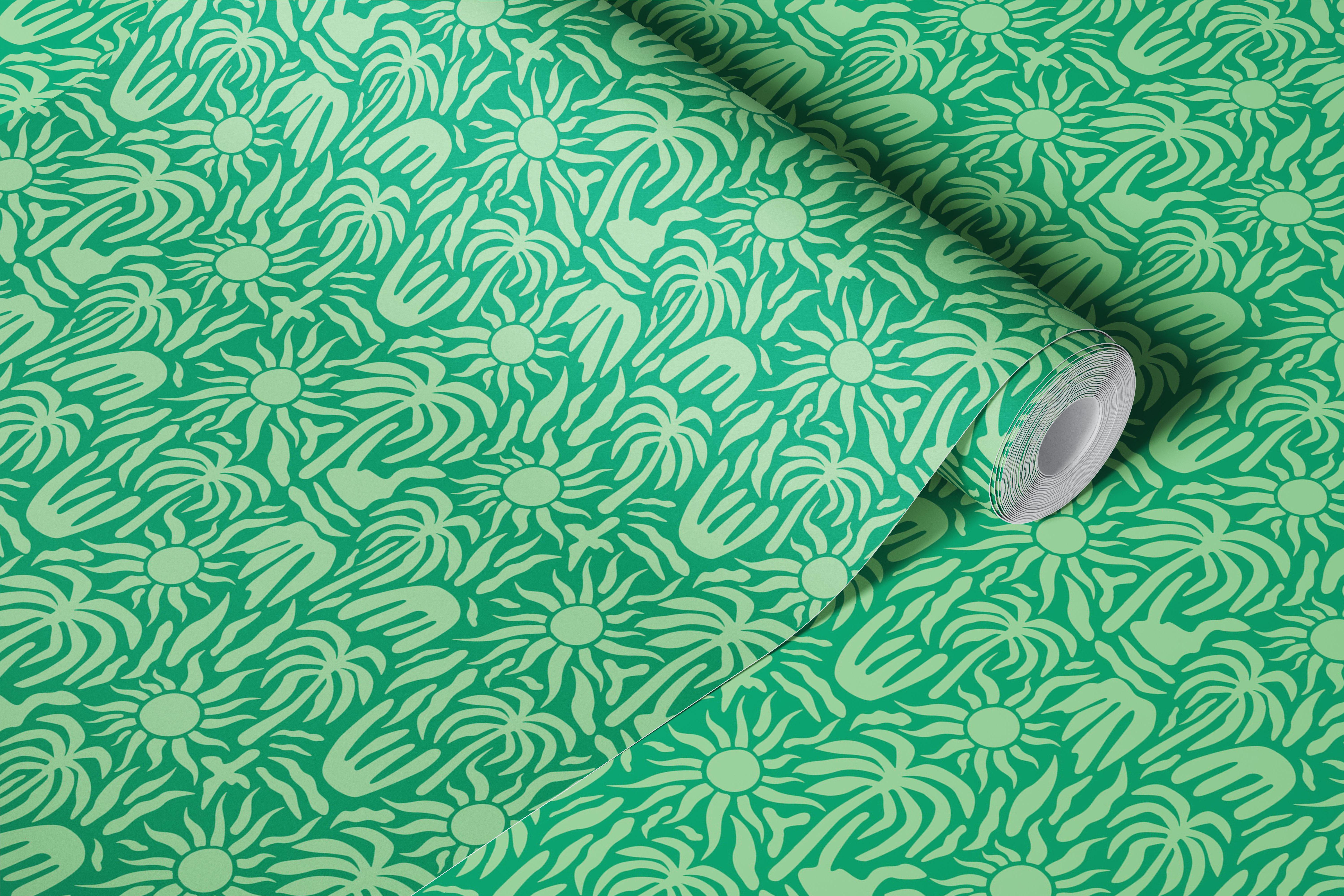 Tropical palm leaves and suns on green background wallpaper